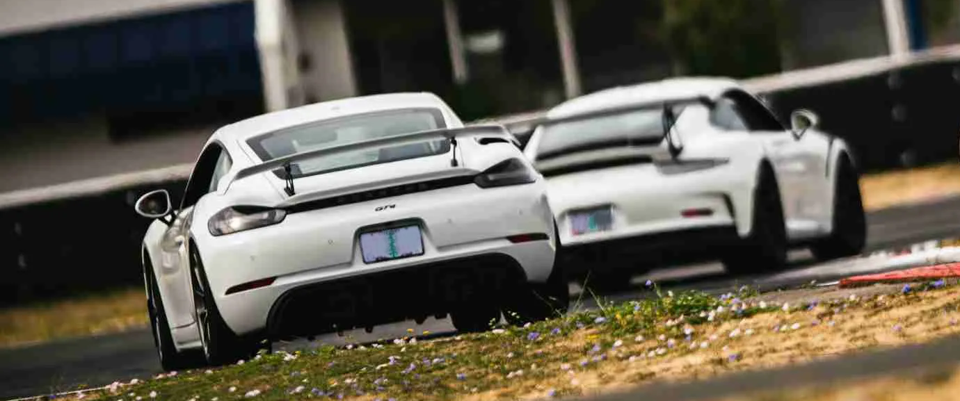 White GT4 and GT3RS on Track